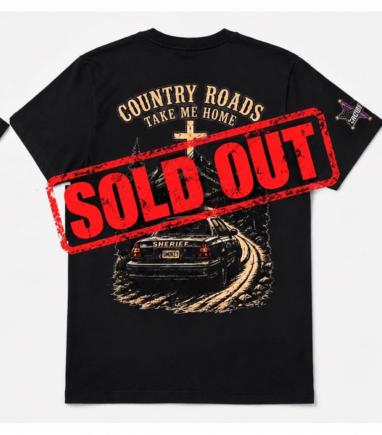 Black t-shirt with Country Roads Take Me Home text and vintage sheriff car graphic, marked with red Sold Out stamp